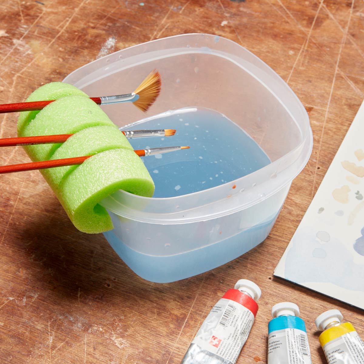 Using a Pool Noodle as a Handy Paintbrush Holder · artistravel